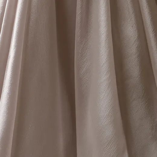 Maggie Sottero Paris asymmetrical basque waist bridal dress fabric detail.