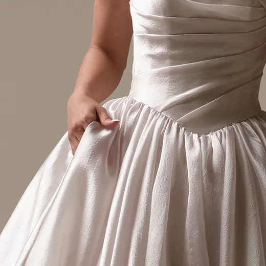 Maggie Sottero Paris front view asymmetrical basque waist bridal dress