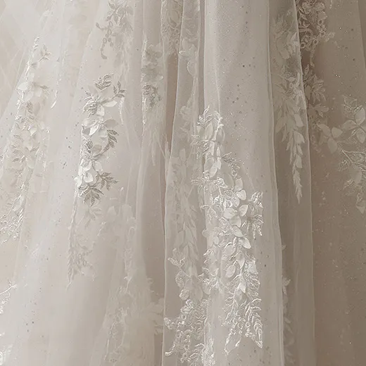 Maggie Sottero Roberta lace detail close-up.