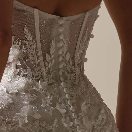 Roberta back view lace fit-and-flare gown with exposed boning by Maggie Sottero