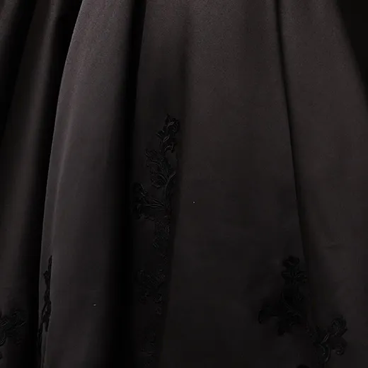 Serafina satin ball gown fabric close-up with floral detail, Maggie Sottero.