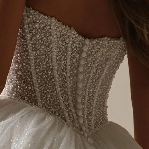 Maggie Sottero ball gown back view with pearl embellished corset.