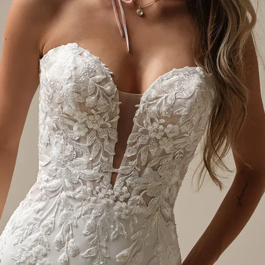 Maggie Sottero Yara front view with plunging illusion neckline and floral lace detailing.