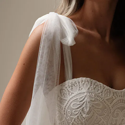 Berkeley lace sheath detail with sheer shoulder tie.