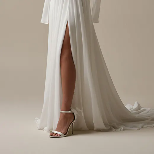 Rebecca Ingram Melody chiffon A-line dress side view with high slit.