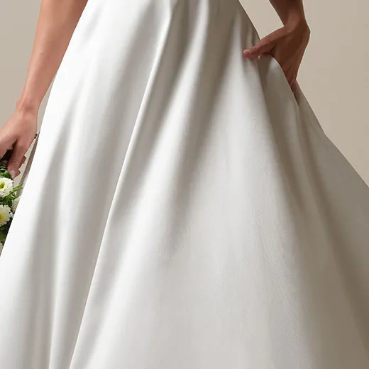 Maggie Sottero Perri Mikado A-line dress front view with banded cuff detail.