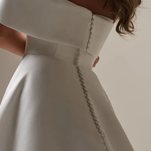Maggie Sottero Perri back view, Mikado A-line with banded cuffs and buttons