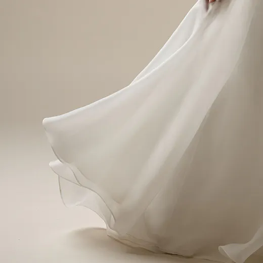Maggie Sottero Sunny gown side view, flowing skirt, strapless A-line wedding dress.