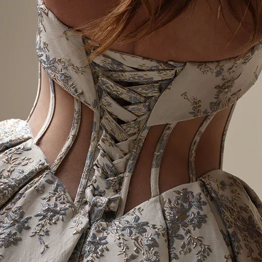 Sottero and Midgley Aberdeen back view with floral jacquard and intricate lace-up detailing.