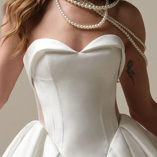 Sottero and Midgley Aberdeen front view with strapless bodice and pearl necklace