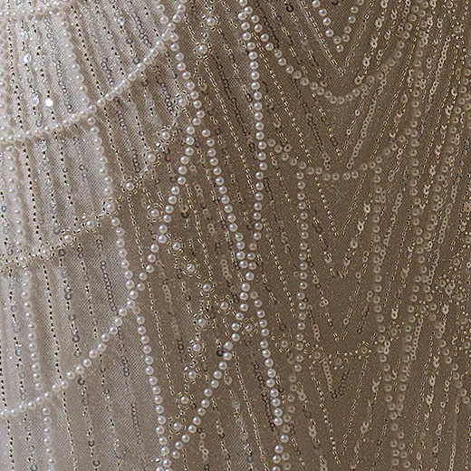 Maggie Sottero Constance sheath gown detailed with draped pearls and sequins