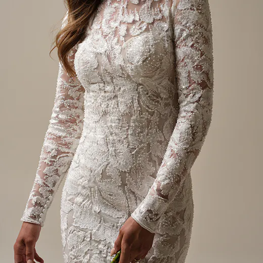 Sottero and Midgley Holland front view turtleneck illusion lace sheath bridal gown.