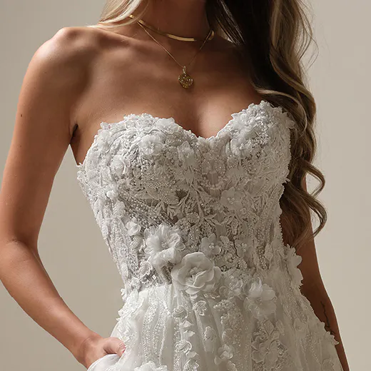 Maggie Sottero Logan A-line dress front view, lace-up, beaded floral details.