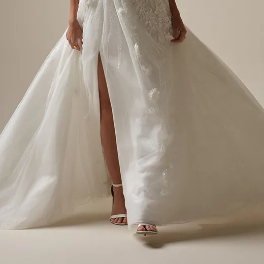 Logan A-line wedding dress front view with lace-up and beaded details, Maggie Sottero