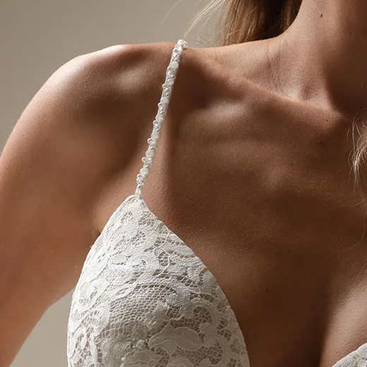 Maggie Sottero Narissa lace gown close-up of bodice and straps.