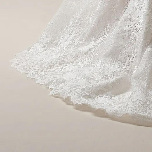 Maggie Sottero Narissa Chantilly lace A-line bridal gown hem detail.