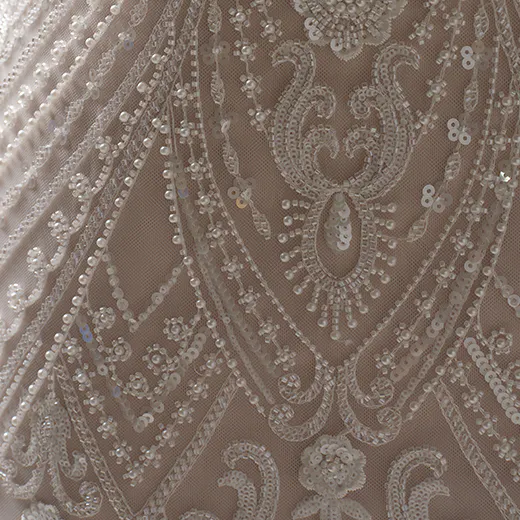 Maggie Sottero Rhett beaded sheath detail with intricate lace and sequins.