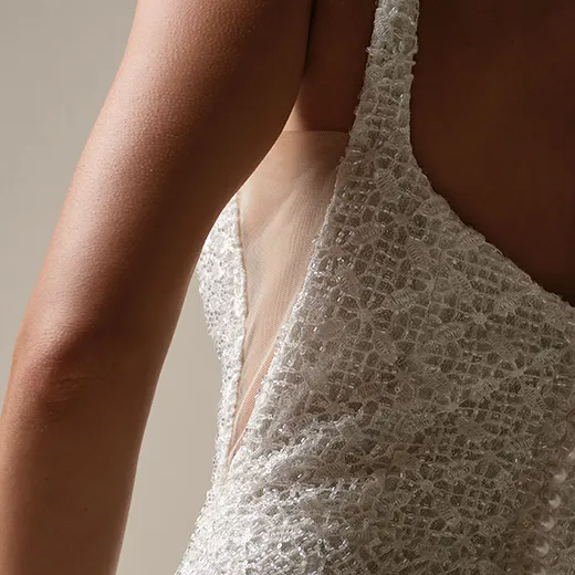 Maggie Sottero star glittering sheath gown side view