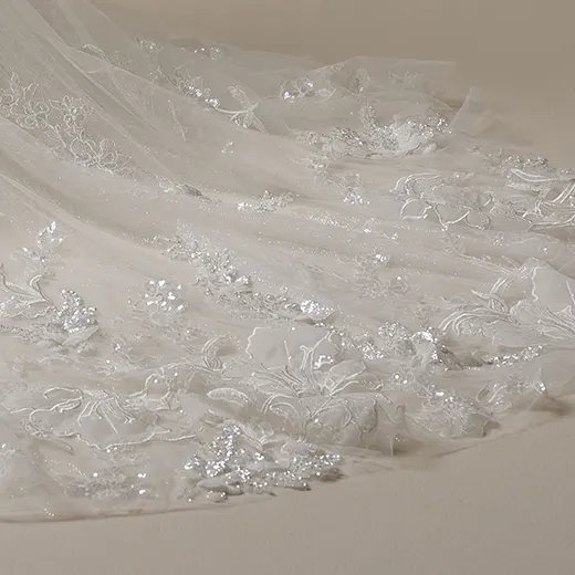 Sottero and Midgley Twilight glitter tulle with floral embroidery train detail.