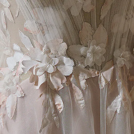 Floral lace detailing on Vineyard hand-painted A-line gown by Maggie Sottero.