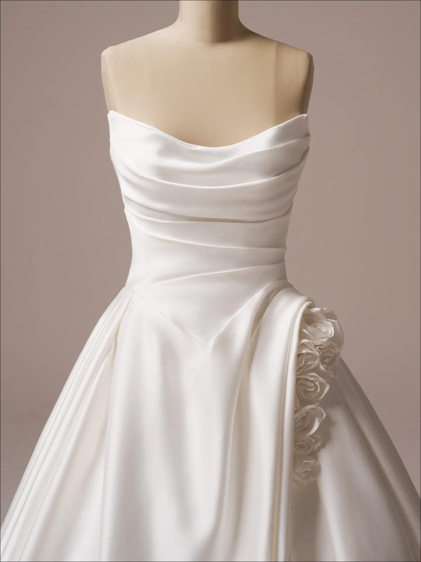 Maggie Sottero Antoinette front view, satin ballgown with floral detail on the side