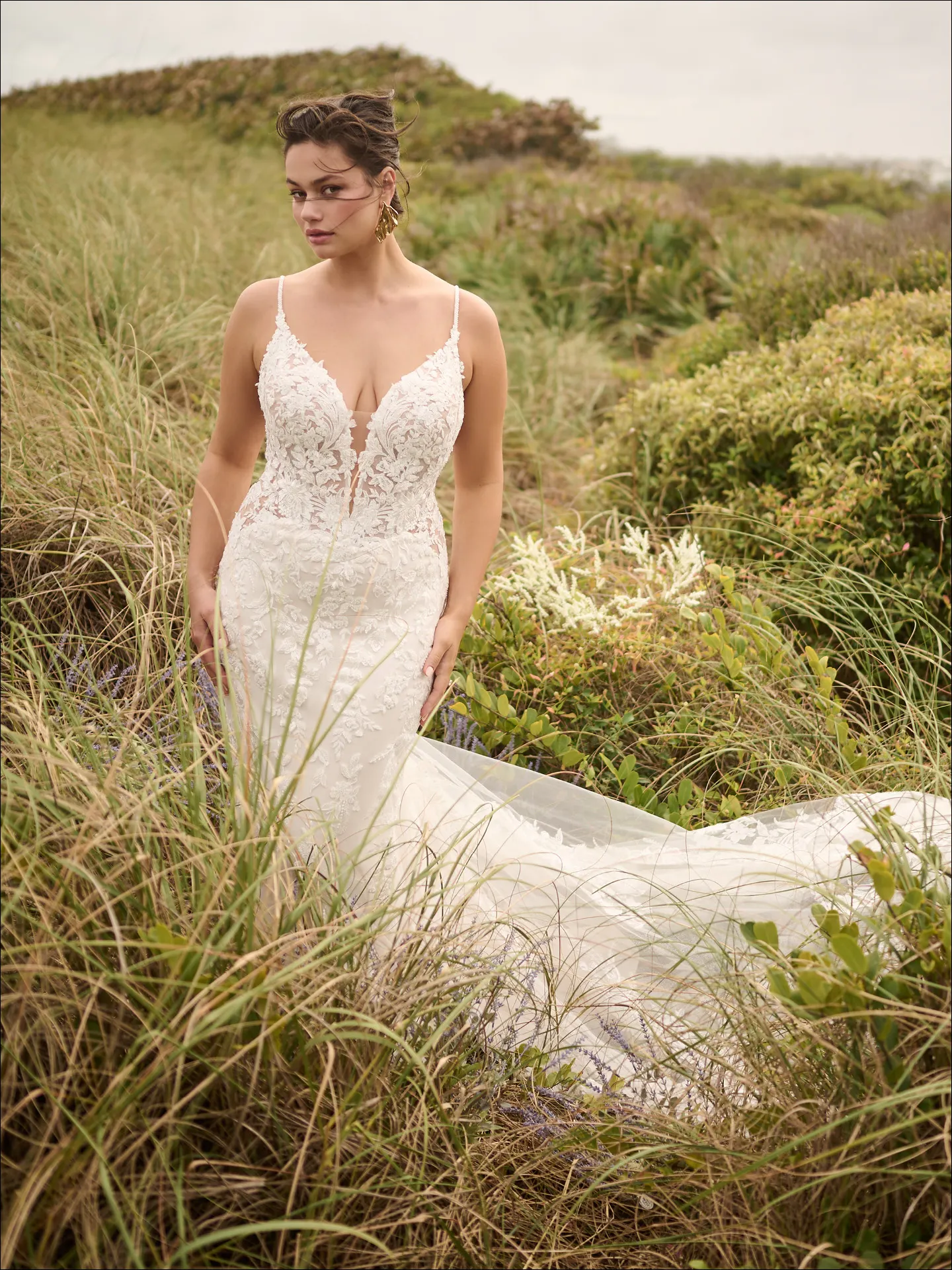 Bianca beaded fit-and-flare wedding gown front view in natural setting Maggie Sottero