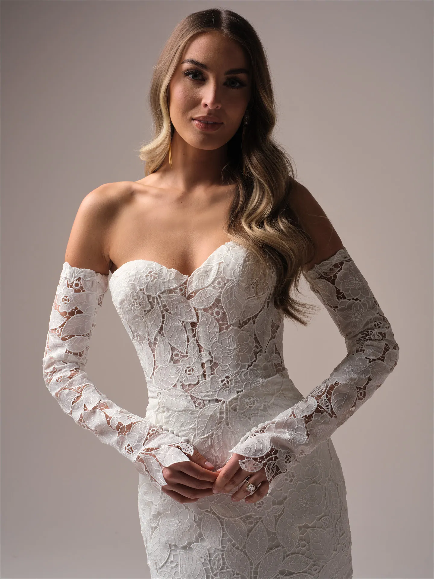 Maggie Sottero Dakota front view lace mermaid wedding dress with off-shoulder long sleeves