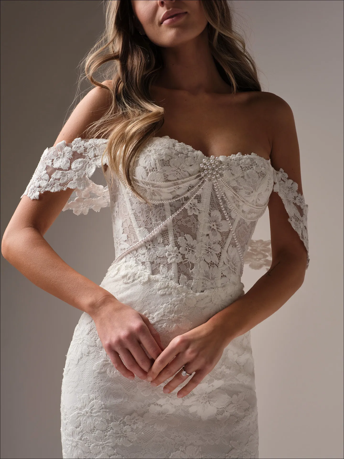 Maggie Sottero Devon front view lace mermaid wedding dress with pearl corset details