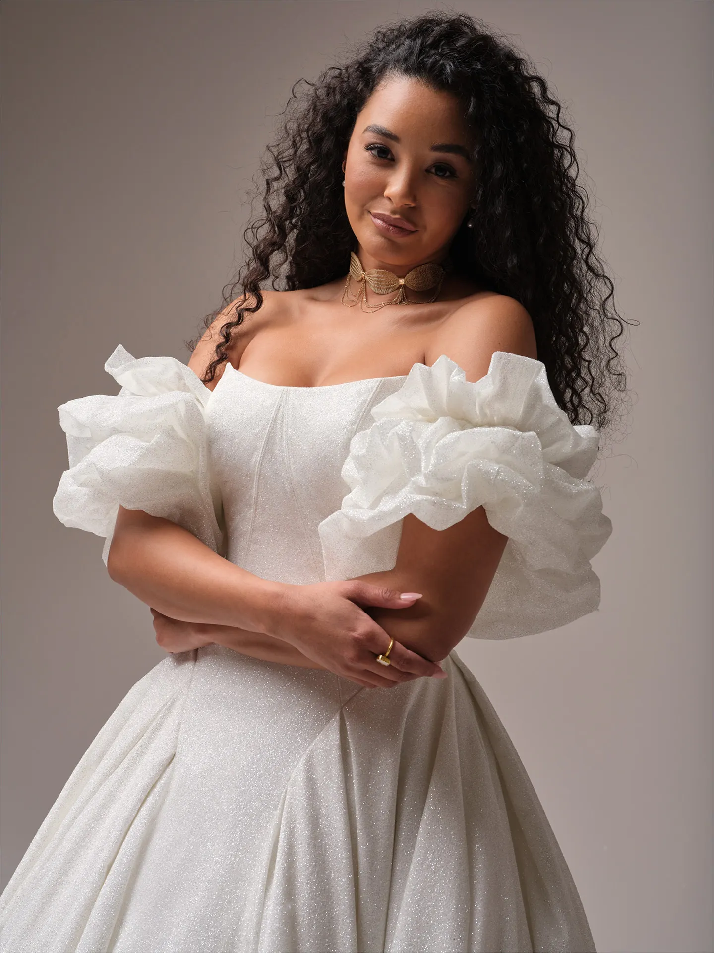 Maggie Sottero Fortune Royale front view sparkly off-shoulder ballgown with ruffled sleeves