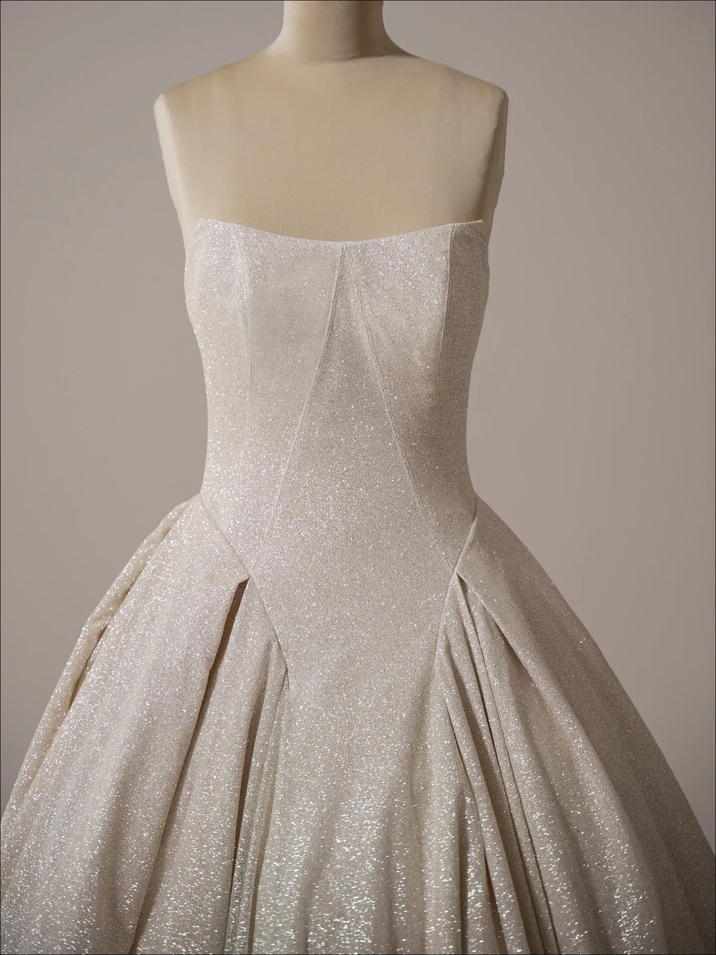 Maggie Sottero Fortune Royale ballgown wedding dress front view with champagne glitter skirt