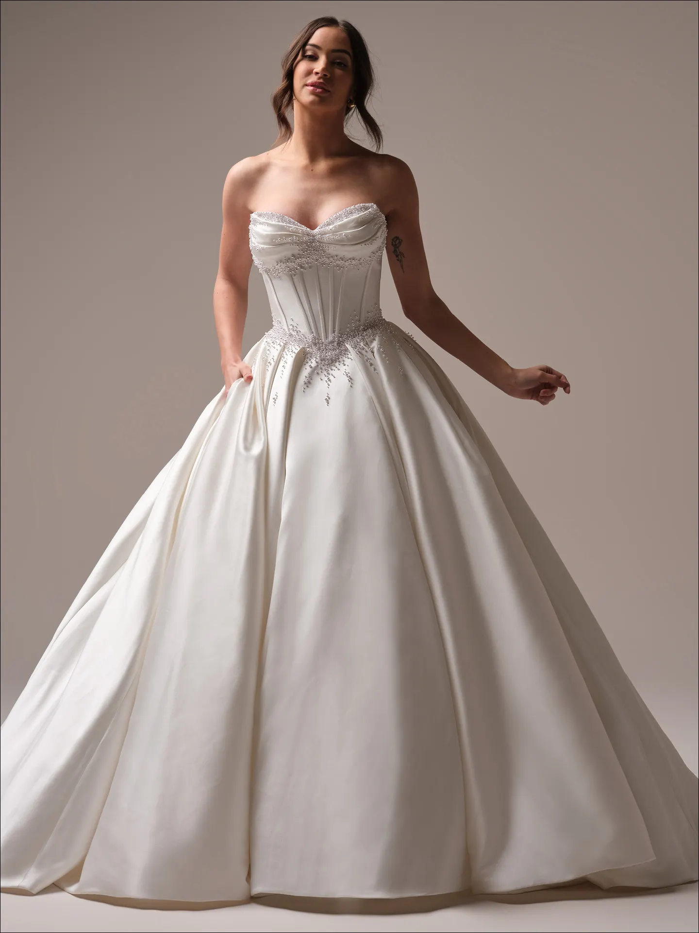 Maggie Sottero Juneau ballgown wedding dress side view with full layered skirt