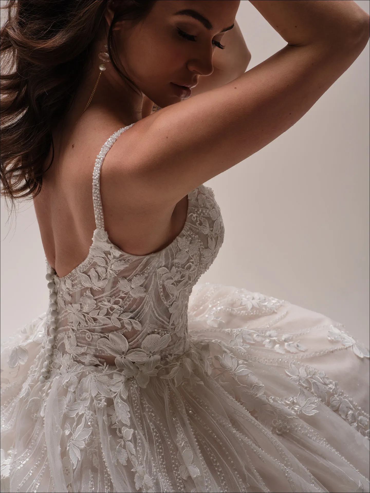Maggie Sottero Juneau ballgown wedding dress side angle with full skirt and fitted bodice