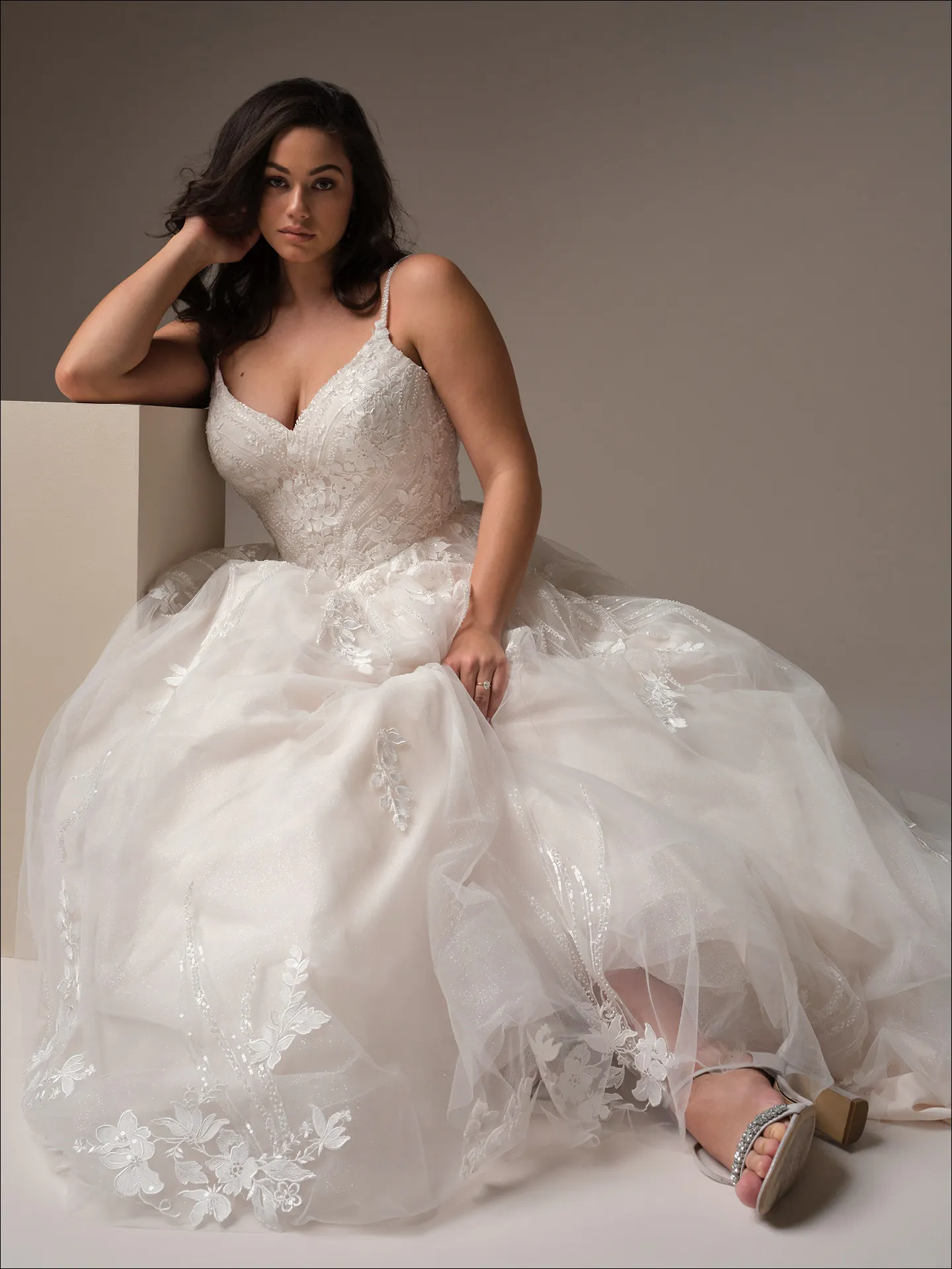 Maggie Sottero Juneau ballgown wedding dress rear view with wide flowing skirt train