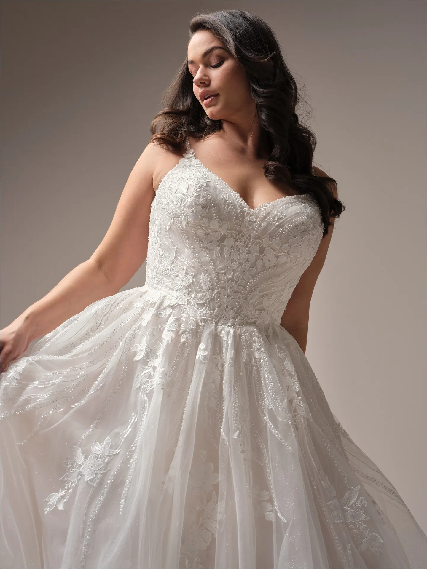 Maggie Sottero Juneau ballgown wedding dress side turn with layered skirt volume