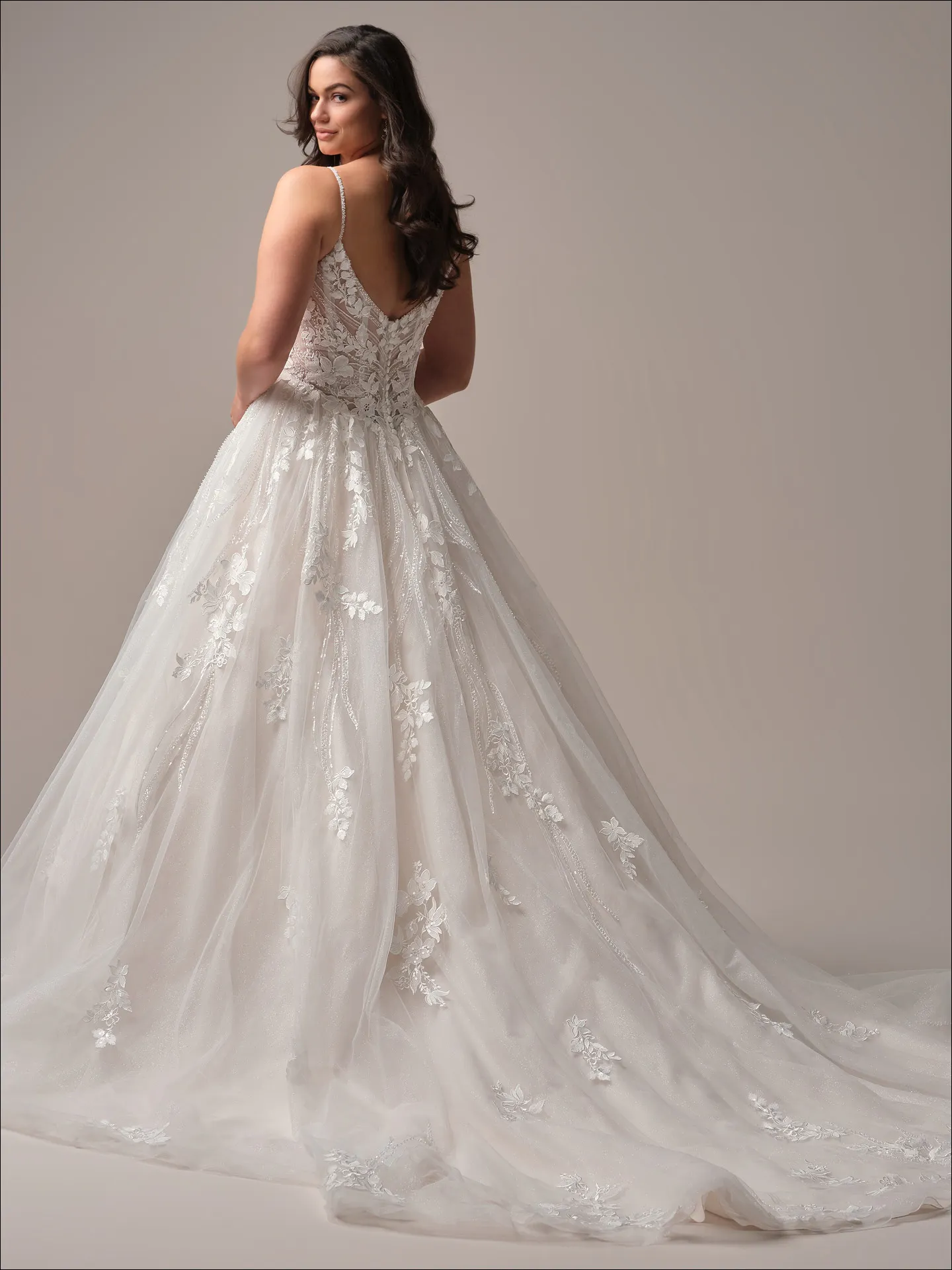 Maggie Sottero Juneau ballgown wedding dress back angle with train trailing behind