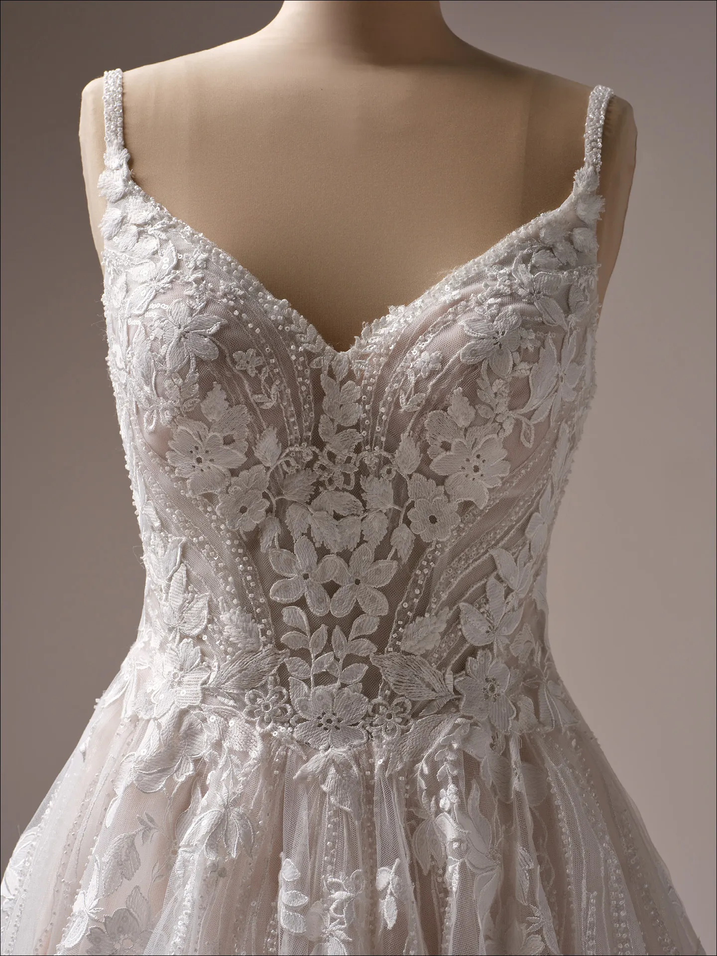 Maggie Sottero Juneau ballgown wedding dress angled side with fitted waist
