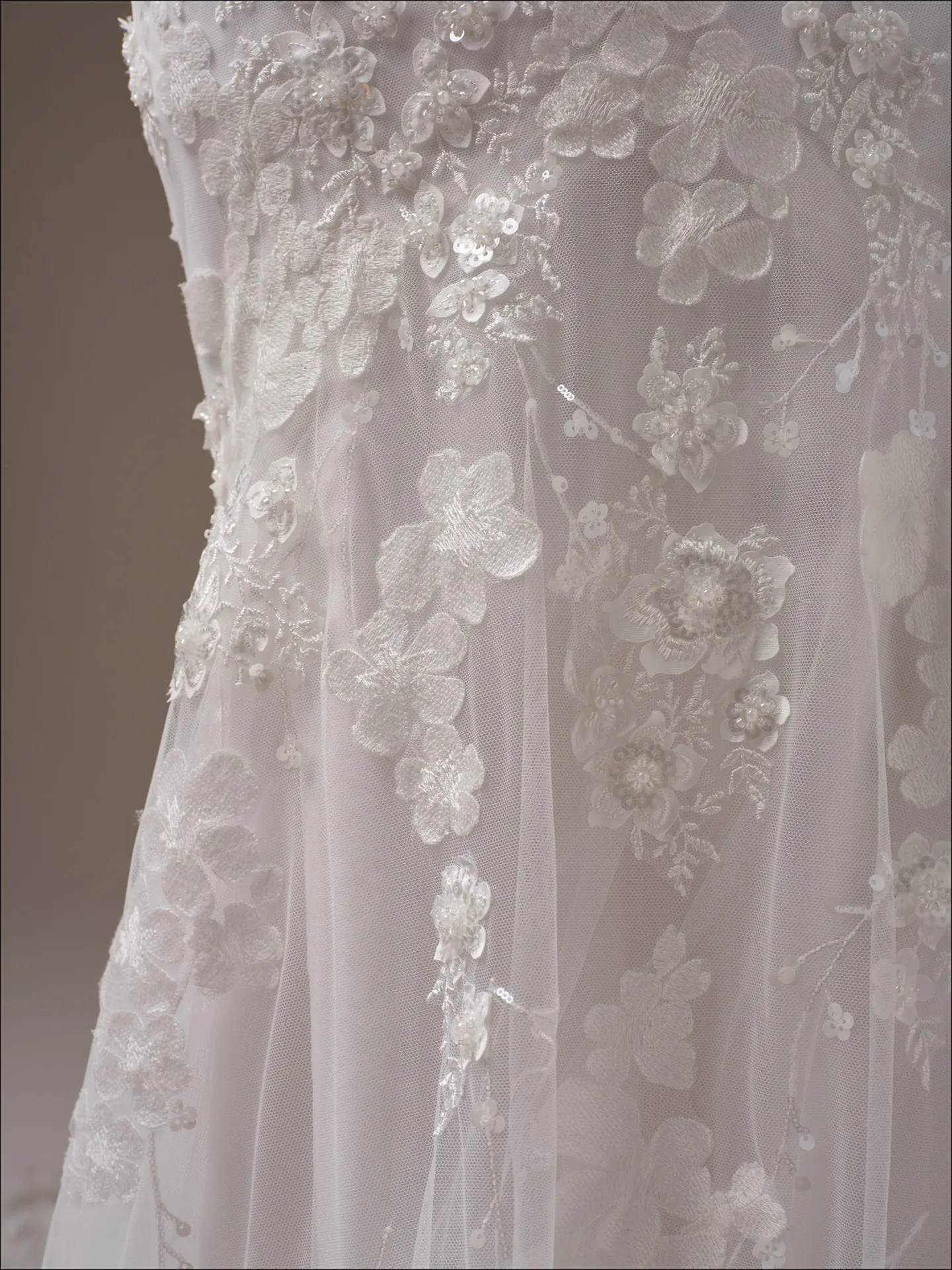 Maggie Sottero Liberty ballgown wedding dress angled side with layered tulle
