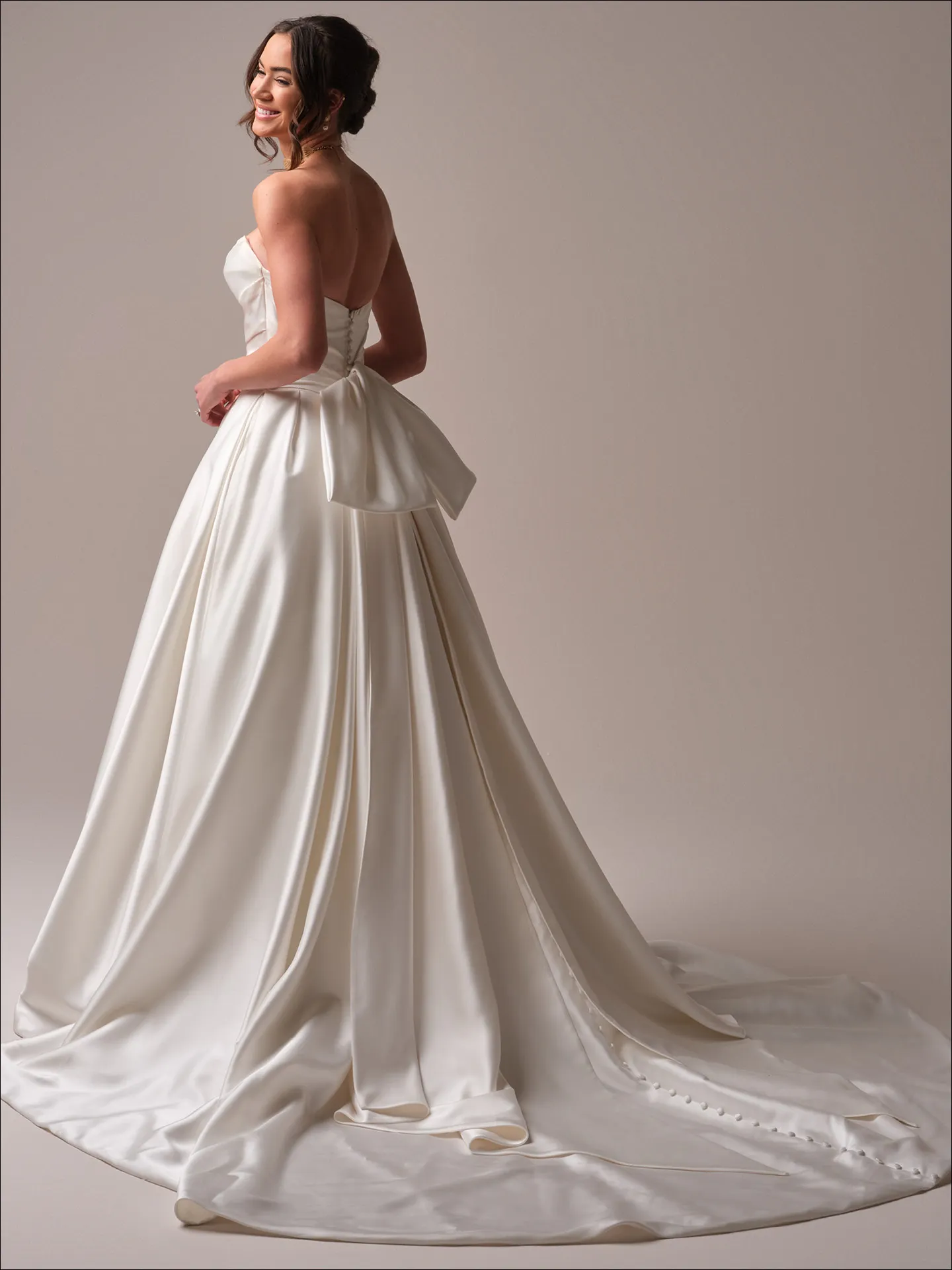 Maggie Sottero Maureen ballgown wedding dress back view with wide tulle train