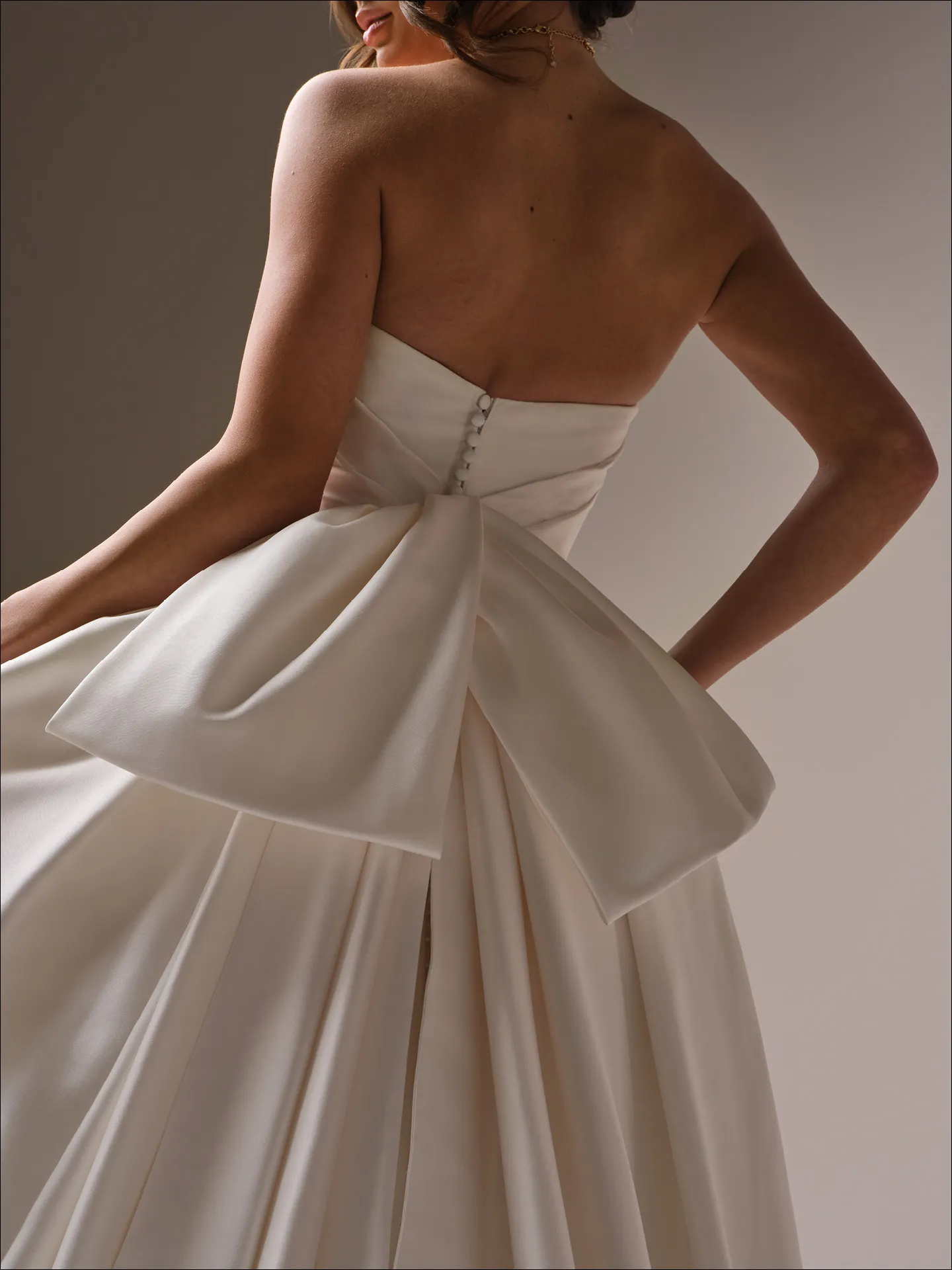 Maggie Sottero Maureen ballgown wedding dress side angle with layered skirt volume