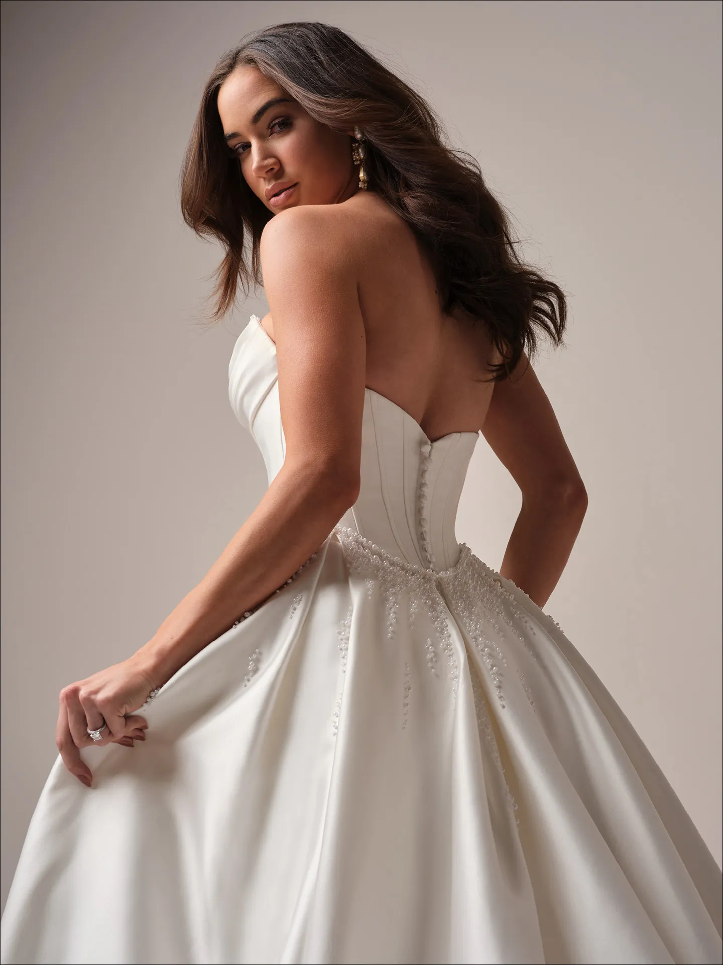 Maggie Sottero Melissa fit and flare wedding dress side angle with sculpted silhouette