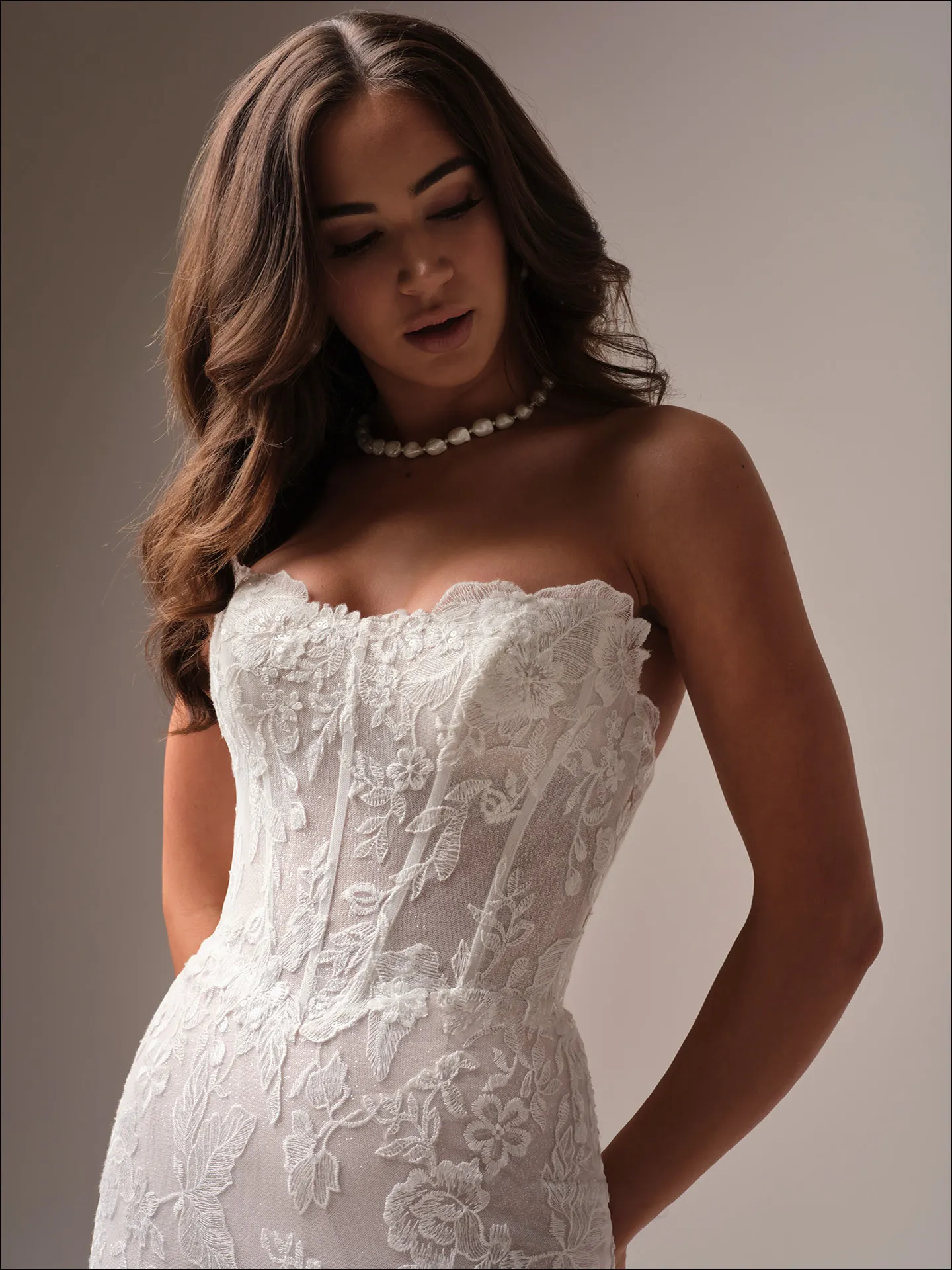 Maggie Sottero Meredith fit and flare wedding dress side view with fitted waist