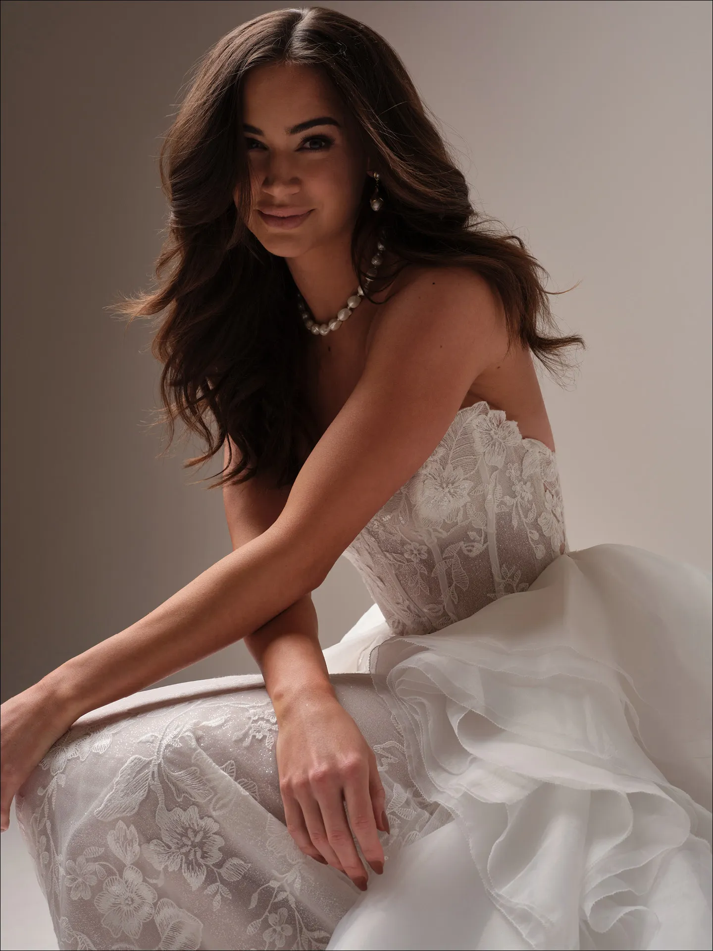 Maggie Sottero Meredith fit and flare wedding dress back angle with flowing train
