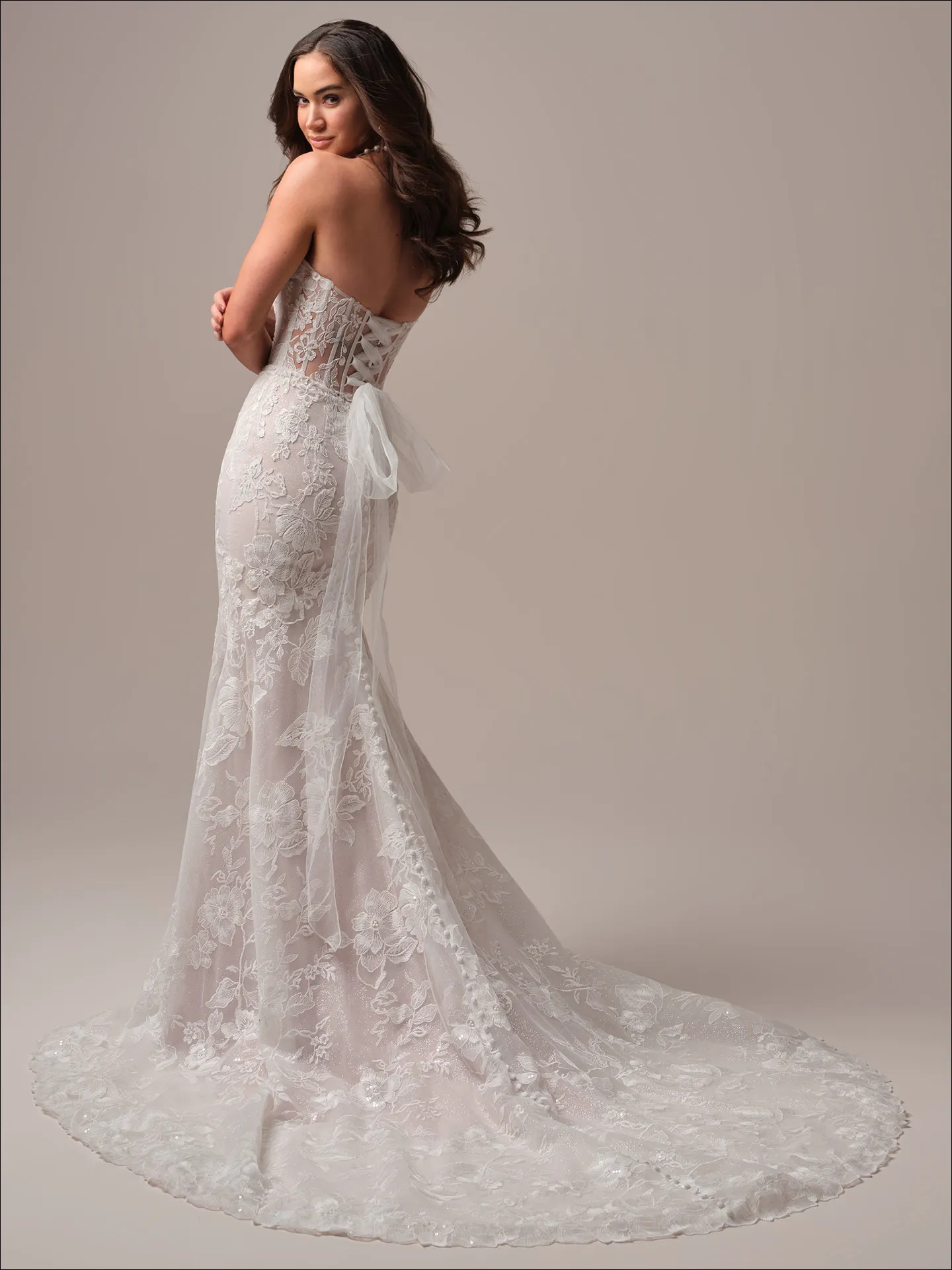 Maggie Sottero Meredith fit and flare wedding dress side angle with fitted skirt