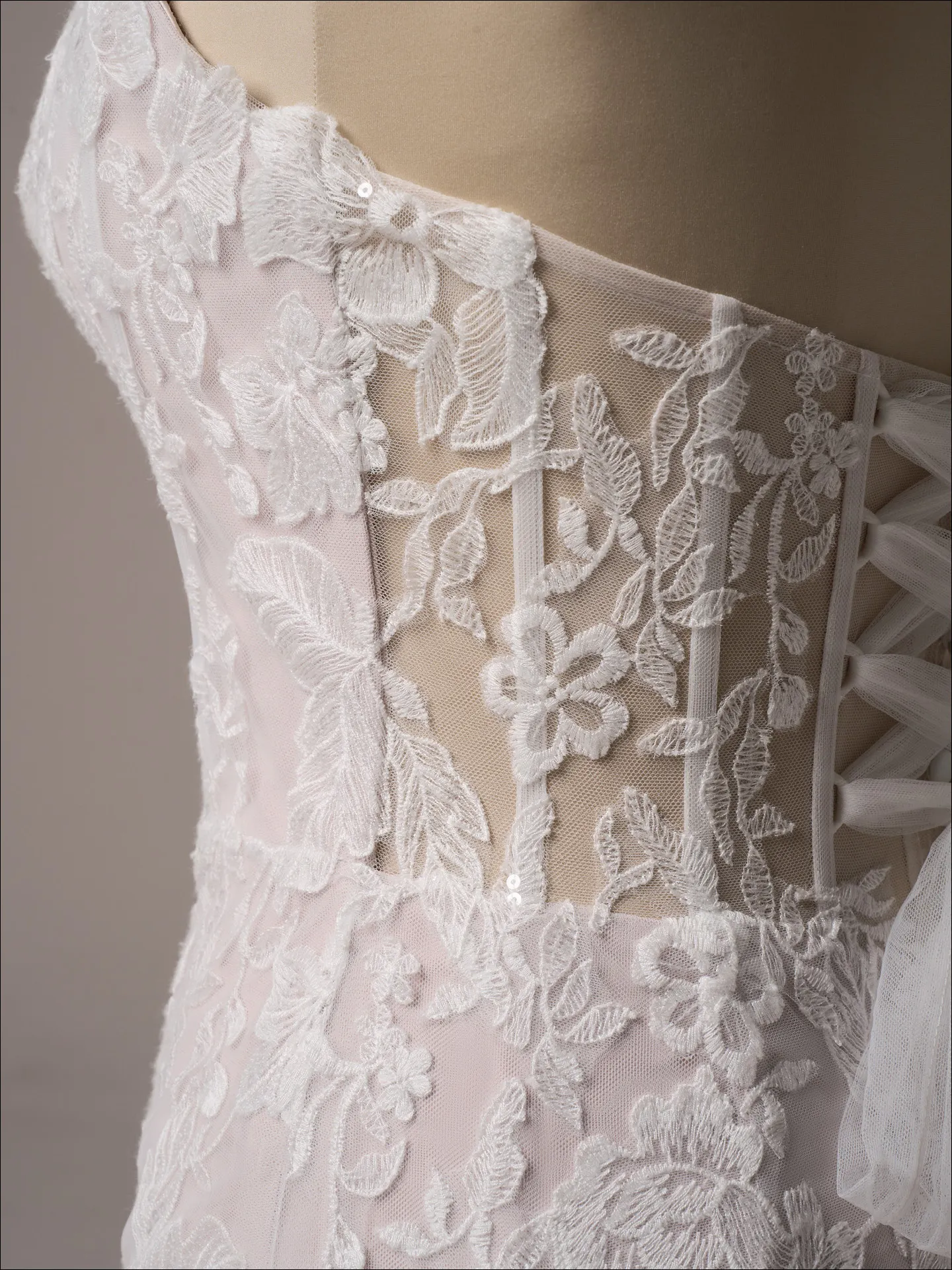 Maggie Sottero Meredith fit and flare wedding dress angled side with lace bodice