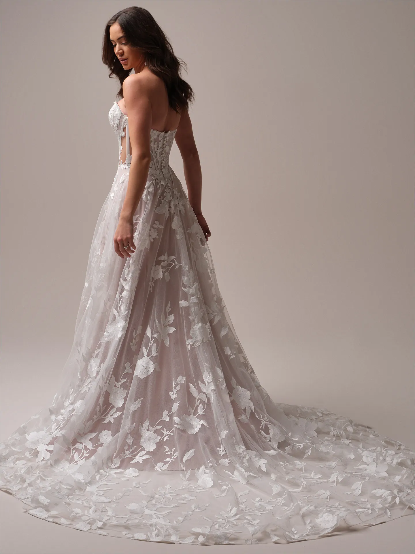 Maggie Sottero Natalie A line wedding dress back angle with extended train