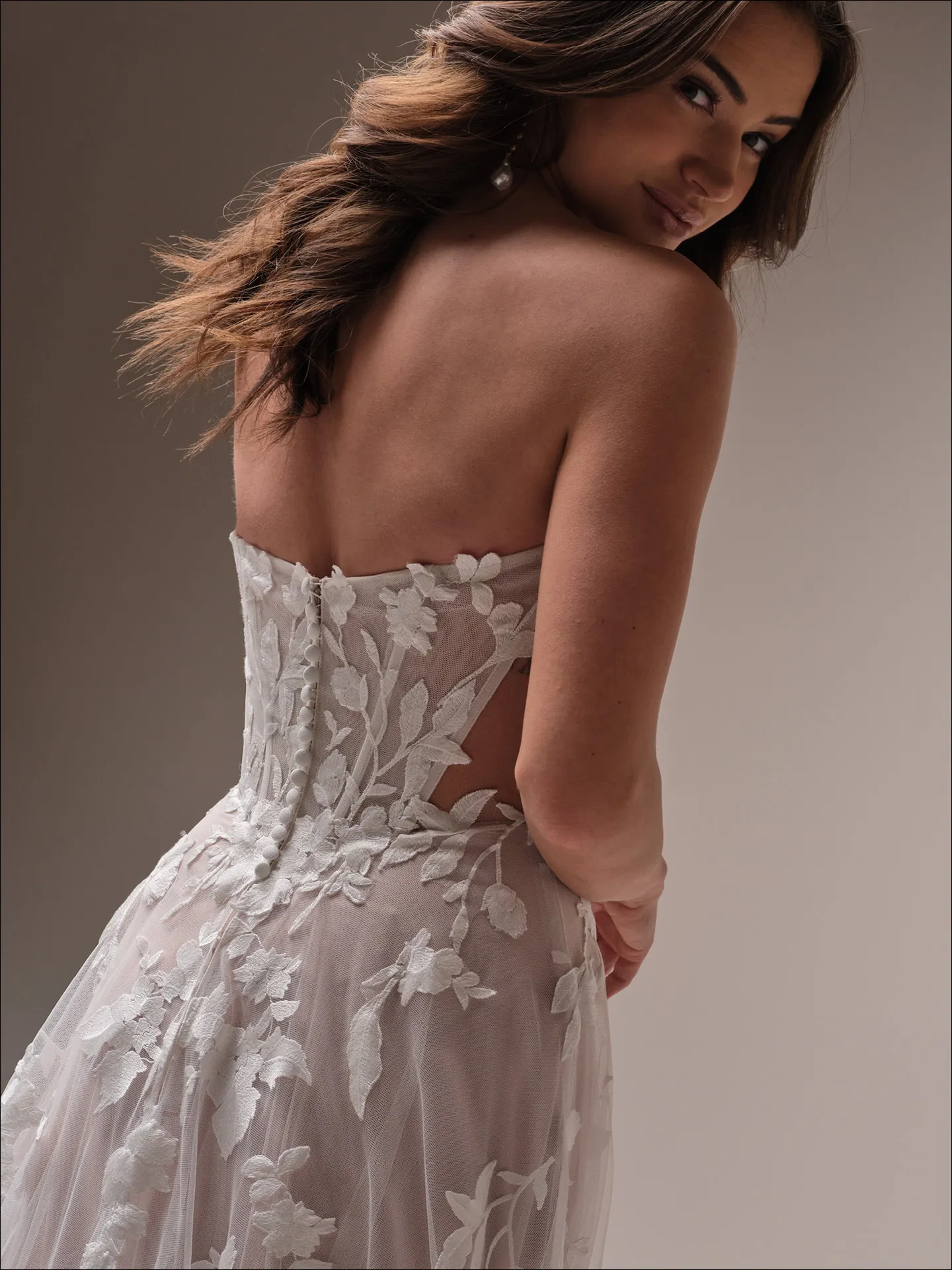 Maggie Sottero Natalie A line wedding dress side profile with soft tulle skirt