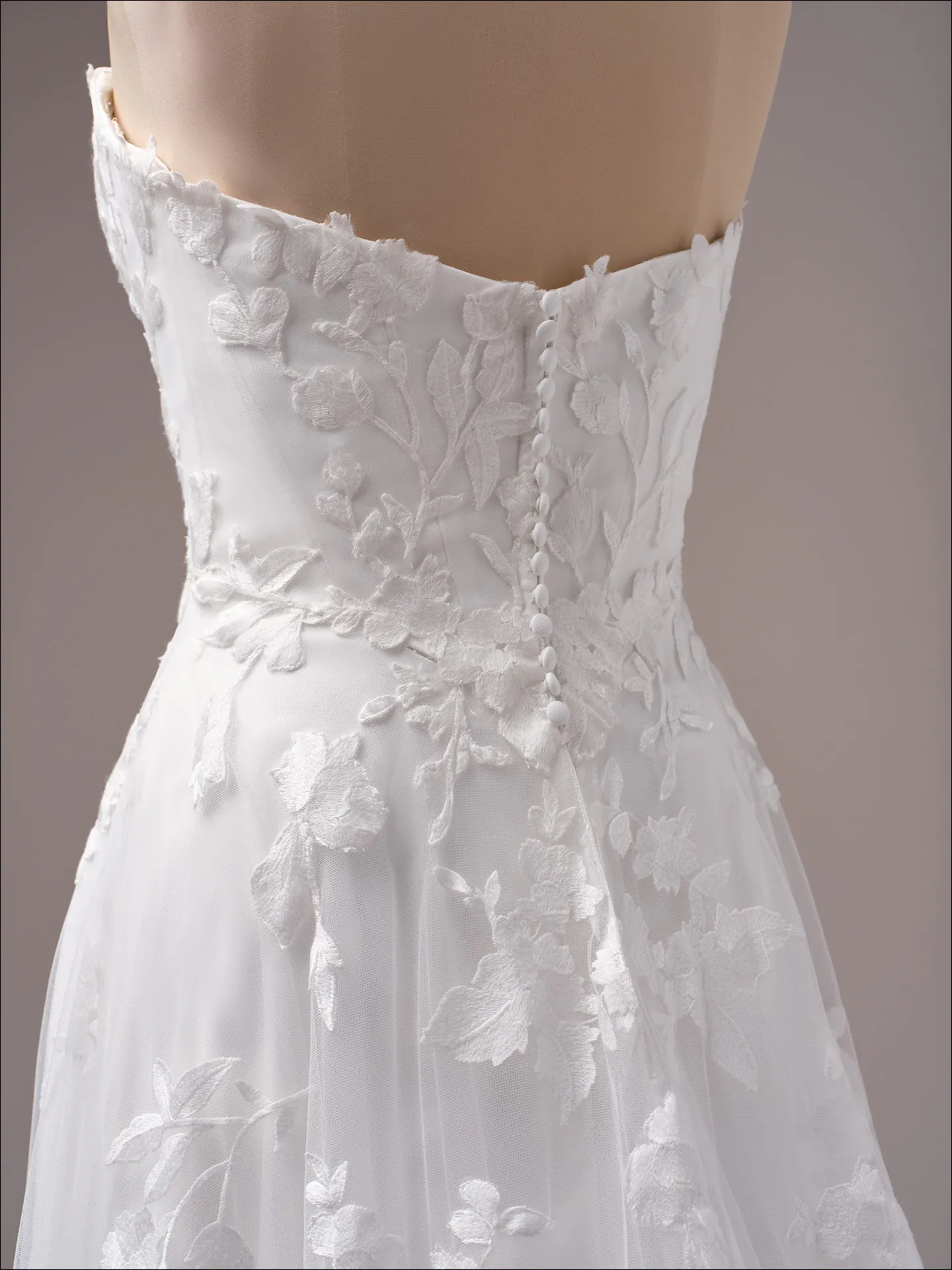Maggie Sottero Natalie A line wedding dress side angle with layered skirt