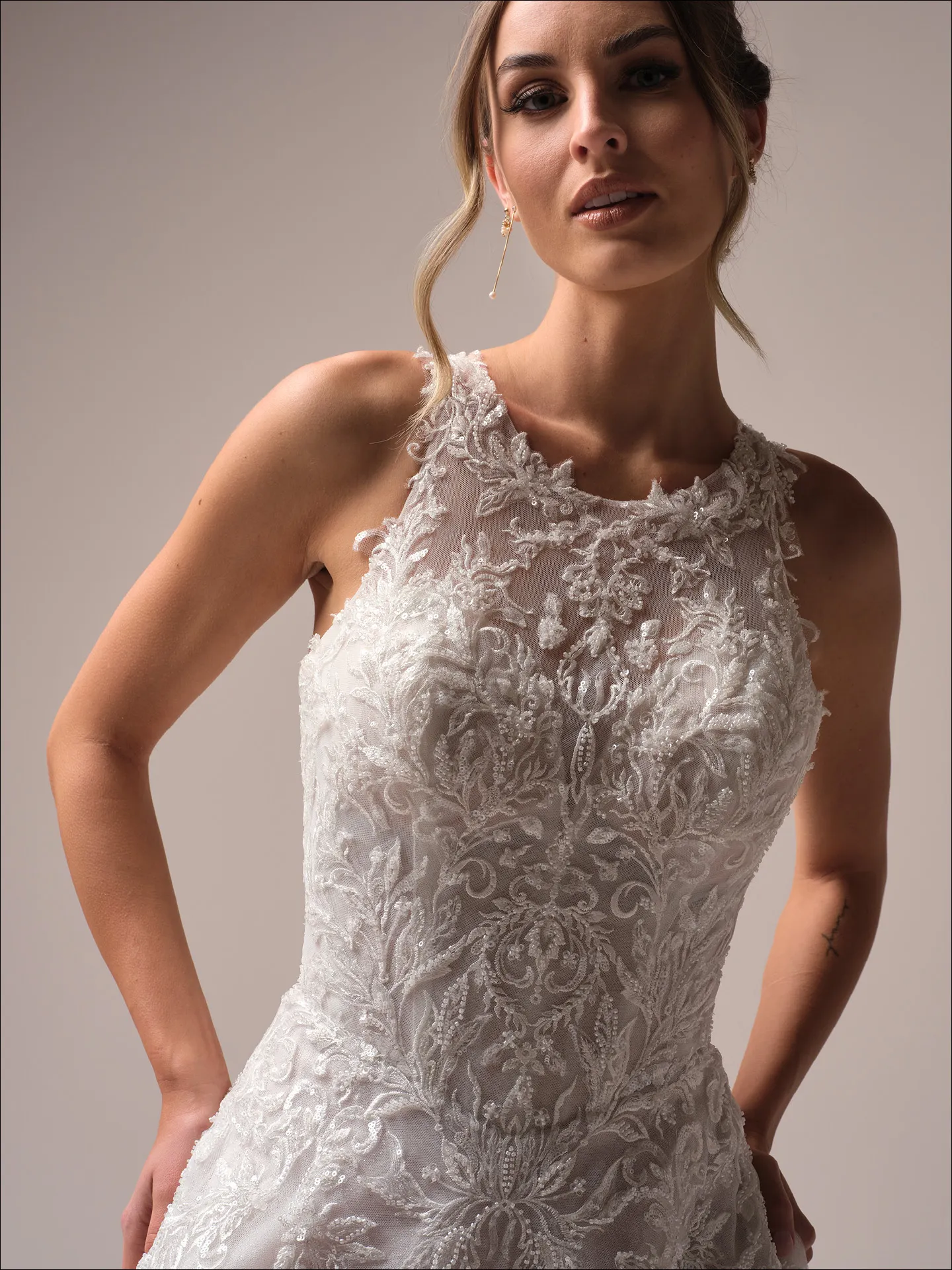 Maggie Sottero Nina A line wedding dress side view with fitted bodice and flowing skirt