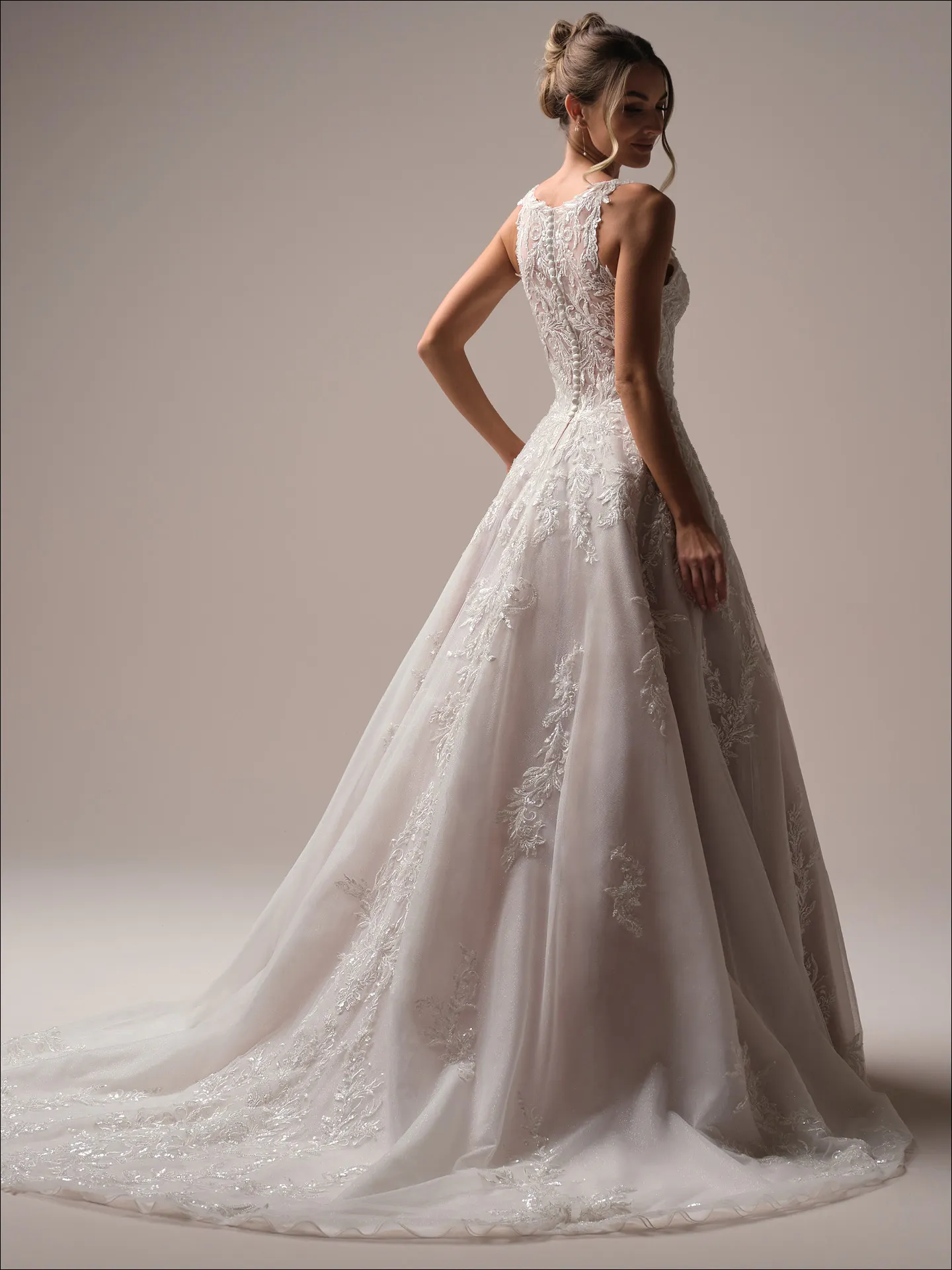 Maggie Sottero Nina A line wedding dress back view with long tulle train