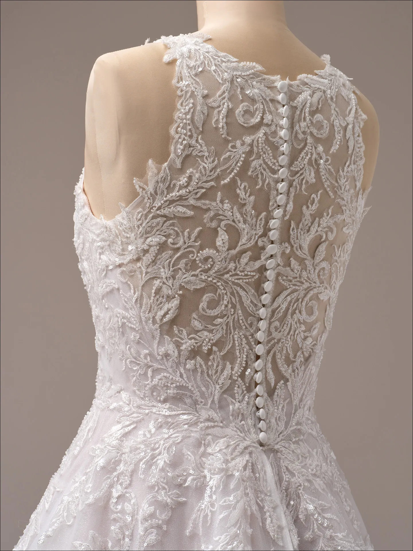Maggie Sottero Nina A line wedding dress side profile with soft tulle skirt